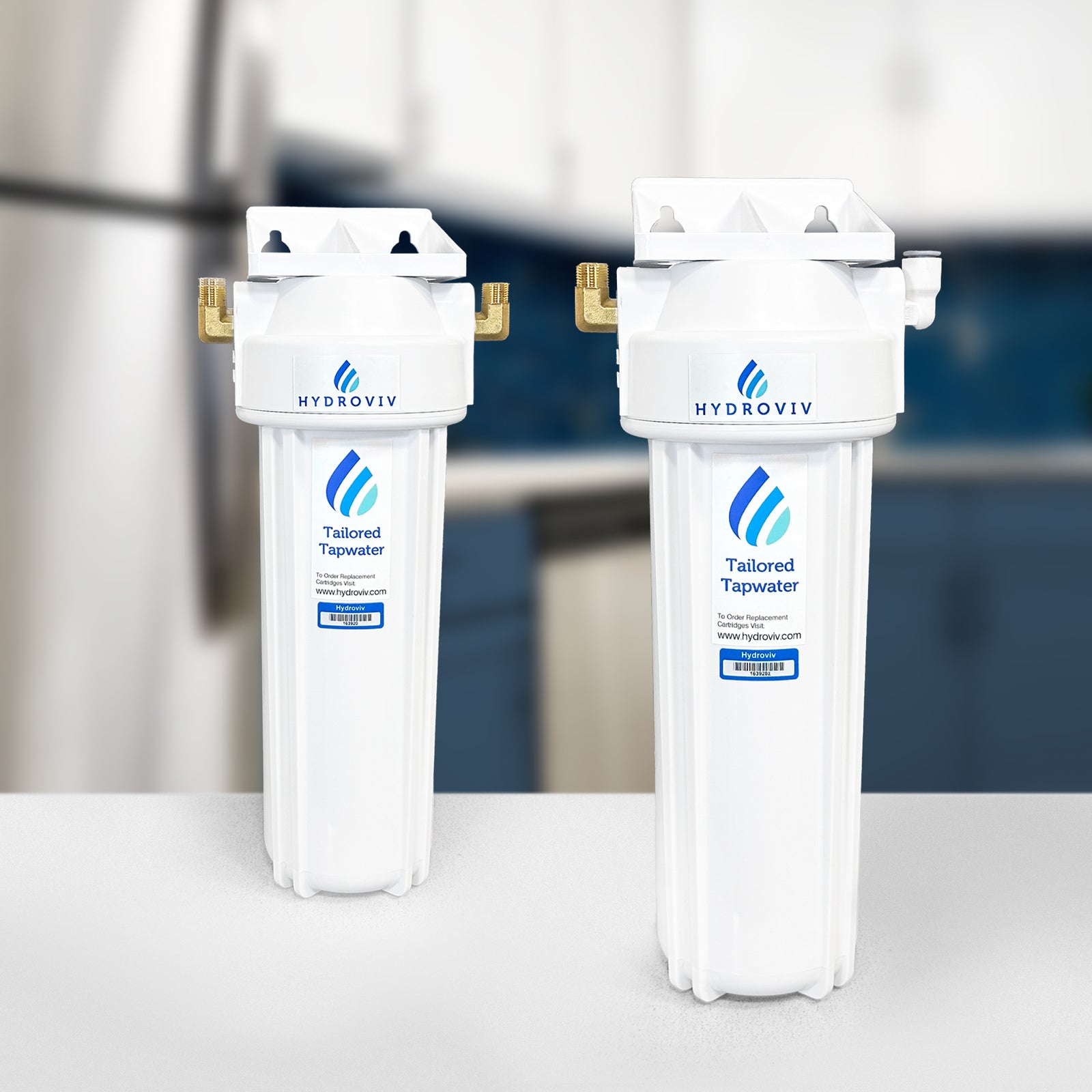 A photo of two Hydroviv drinking water filters sitting on top of a table. The background is blurred.